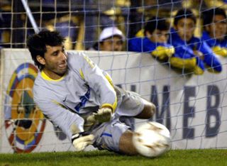 Boca Juniors goalkeeper Roberto Abbondanzieri saves a penalty against Sao Caetano in the Copa Libertadores in May 2004.