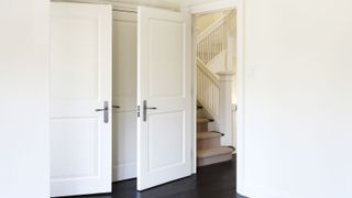 Two white panel doors on newly decorated room
