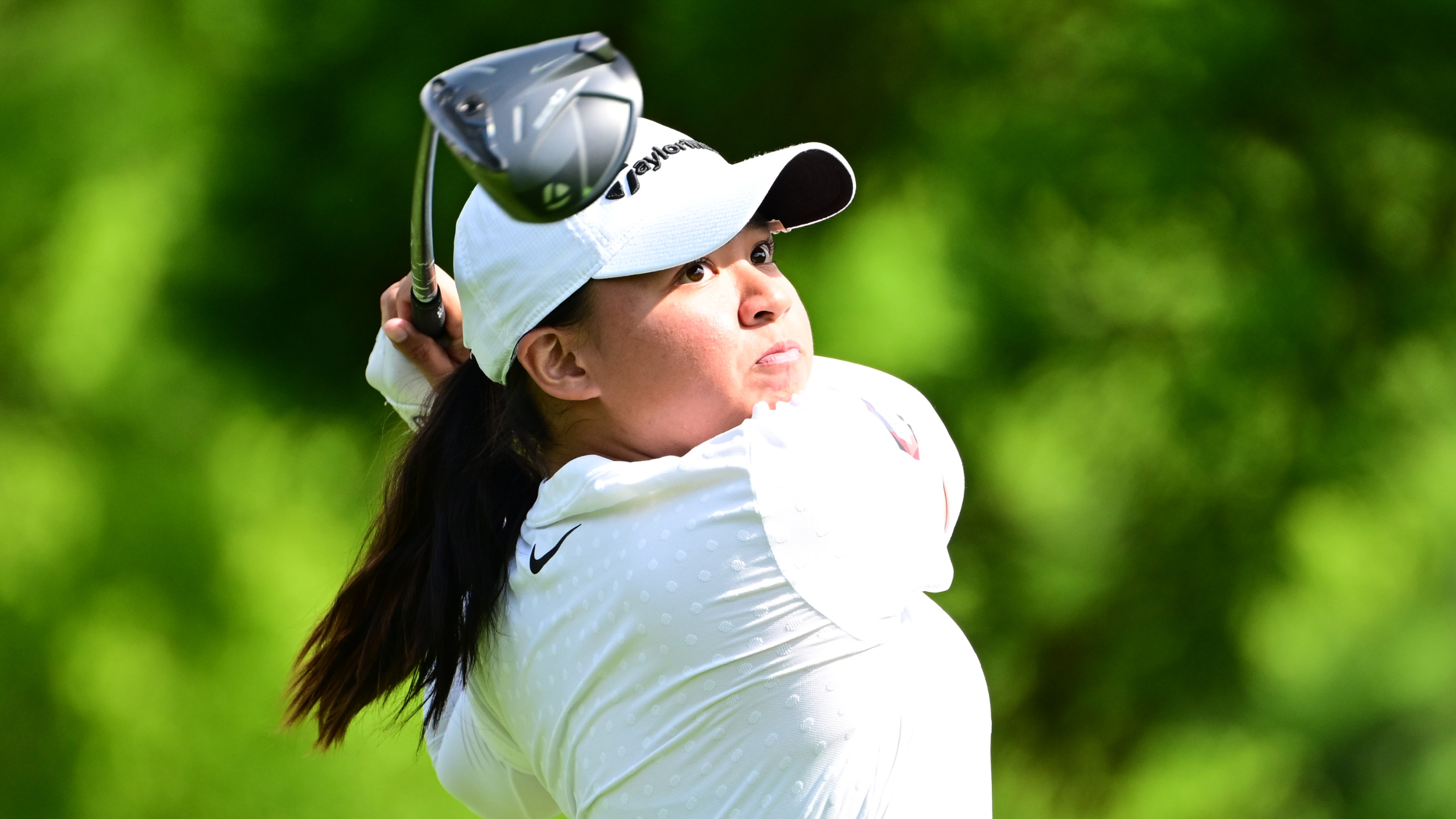 Reanne Malixi hitting a drive