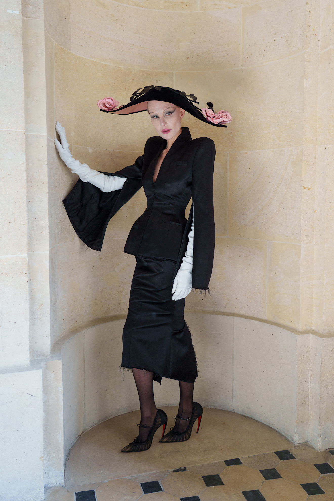A model wore an oversize hat on the Matieres Fecales Spring 2026 runway