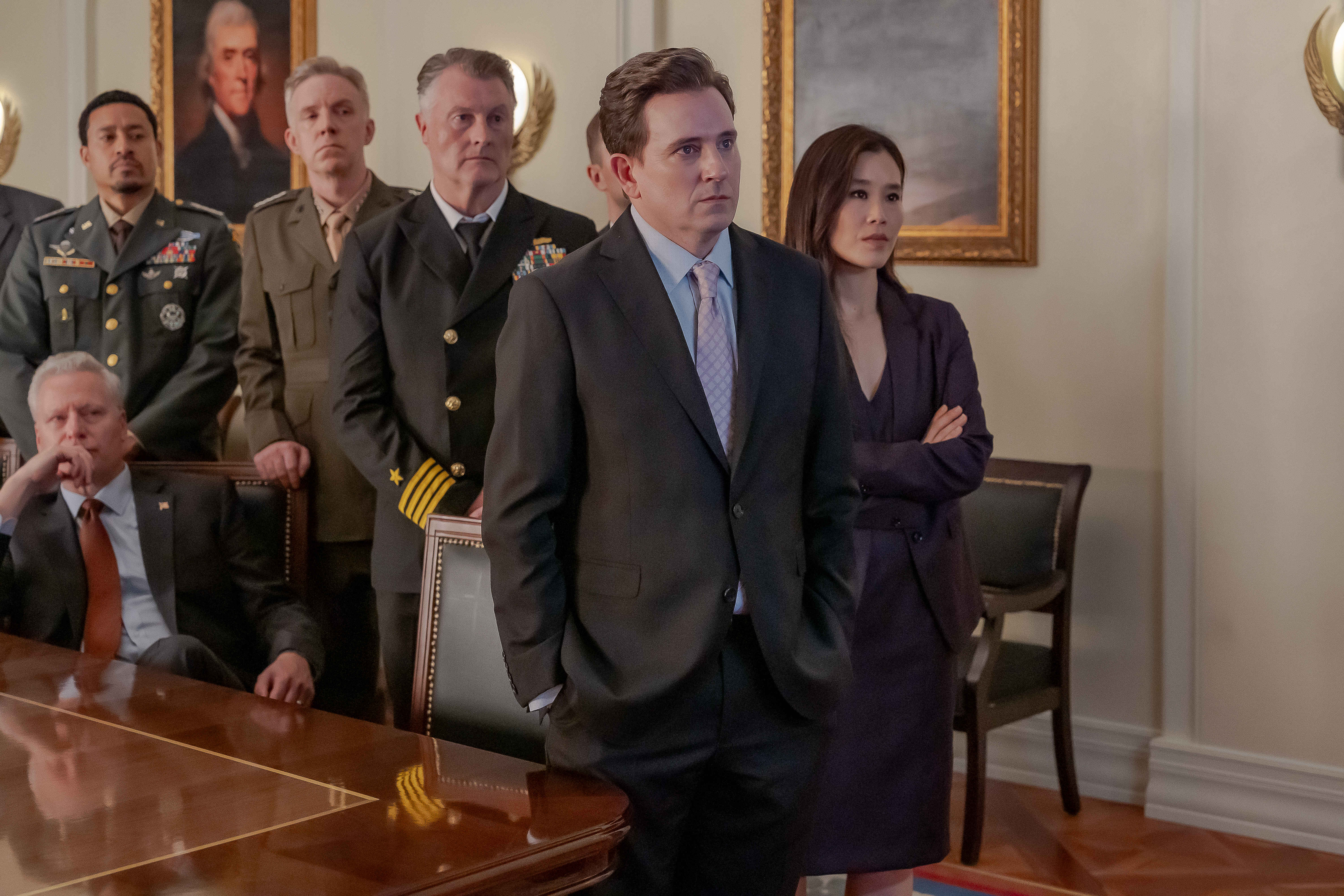 A group of people stand in a White House office, in &#039;Tempest.&#039;