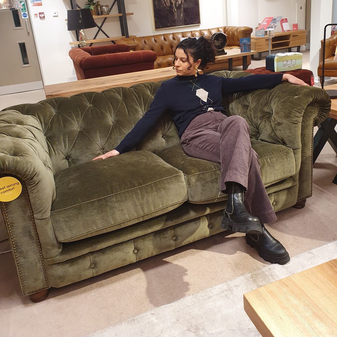 Sara sitting on the Furniture Village Shackleton At The Helm Apsley sofa