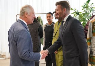 King Charles attends the British Fashion Council awards, and shakes hands with David Beckham