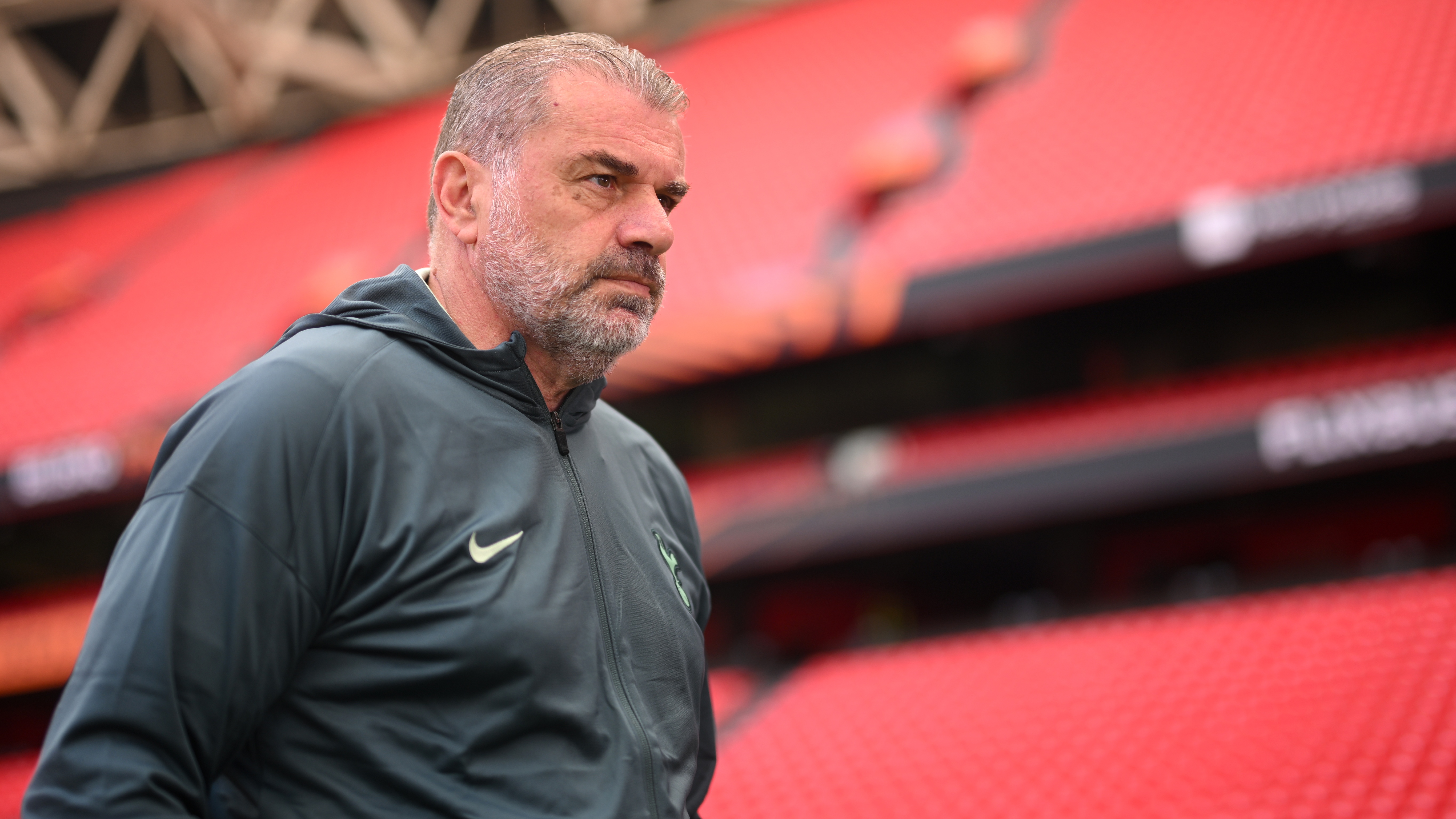 Ange Postecoglou walks around the Estadio de San Mamés in Bilbao.