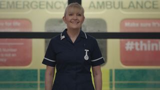 Cathy Shipton as Duffy in Casualty. Smiling and looking directly at camera