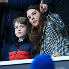 Catherine, Duchess of Cambridge speaks to their son Prince George of Cambridge prior to the Guinness Six Nations Rugby match between England and Wales at Twickenham Stadium on February 26, 2022 in London, England.