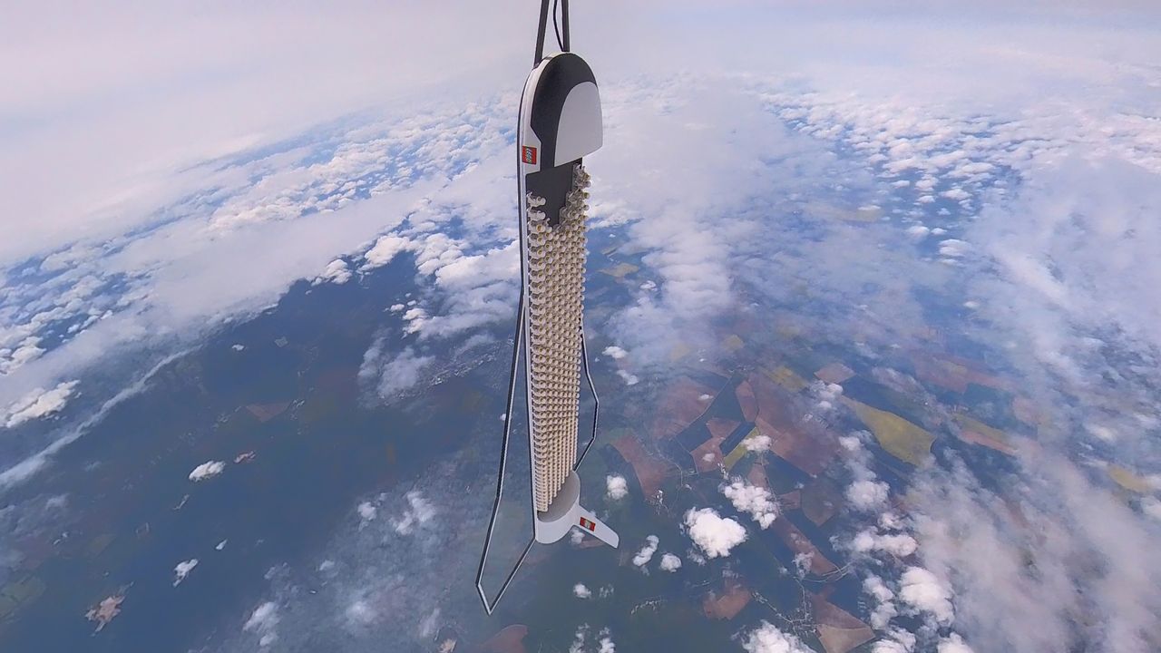 The mini space shuttle with its passengers landed under a parachute after the stratospheric balloon burst.