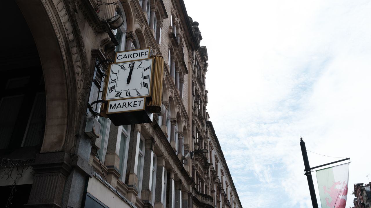 Cardiff Market clock against a blue and cloudy sky, taken on the Fujifilm X-E5.