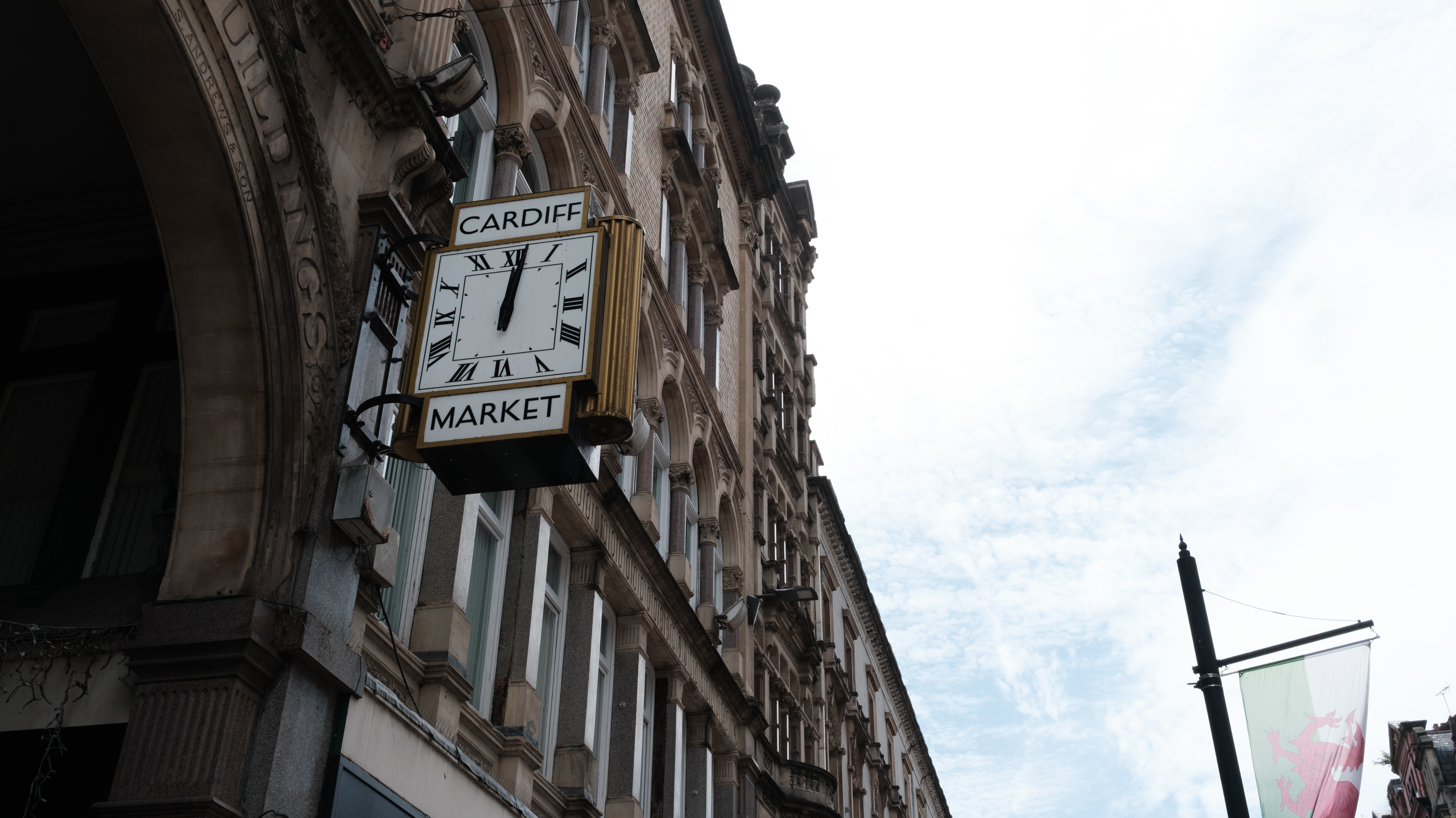 Cardiff Market clock against a blue and cloudy sky, taken on the Fujifilm X-E5.