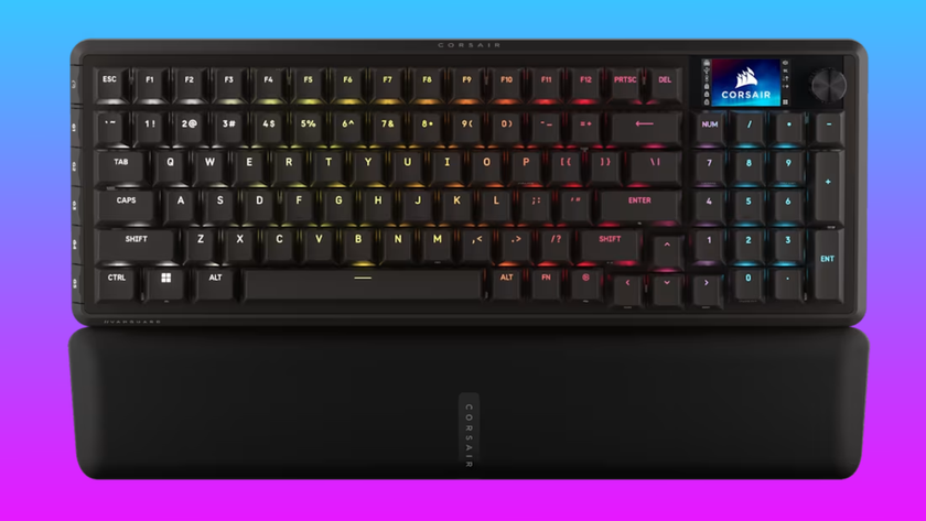 The Corsair Vanguard Pro 96 wired keyboard floats in a pink-blue gradient void.