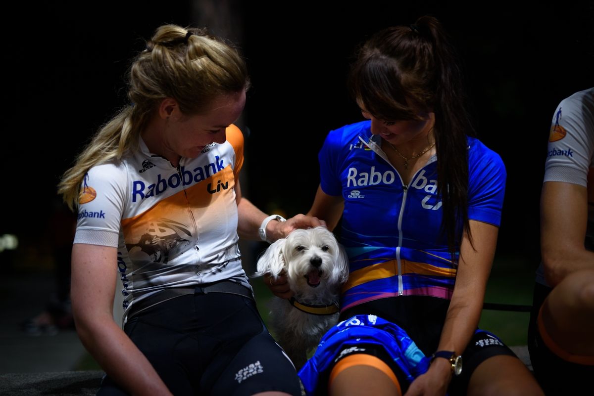 Anna Van Der Breggen and teammate Katarzyna Niewiadoma make a new friend