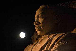 The moon, or supermoon, is seen as it sets over the Martin Luther King Jr. Memorial on Monday (Nov. 14) in Washington.