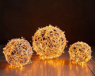 Three illuminated LED vine spheres made from rattan