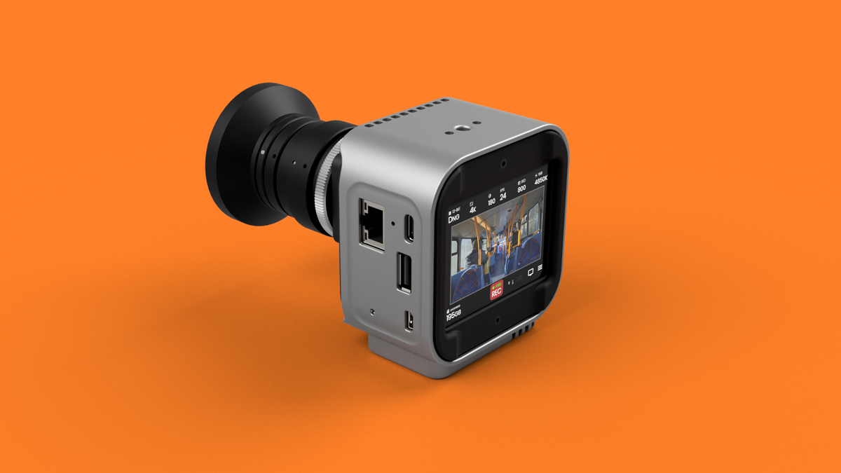 Octopus Cinema 16 cine camera on a orange background with lens attached