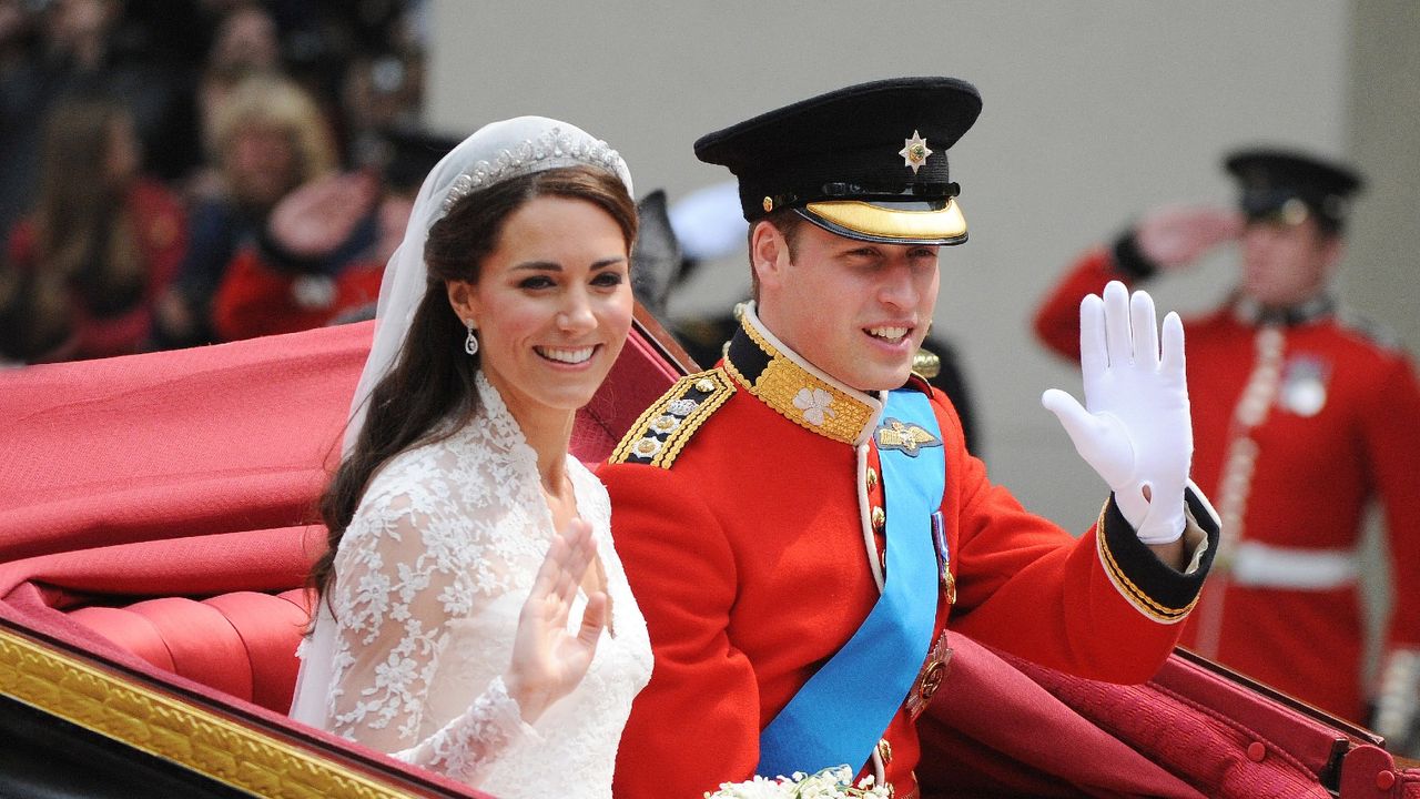 Prince William and Kate Middleton&#039;s wedding guests cheer them as they depart Westminster Abbey after there marriage on April 29, 2011 in London, England. The marriage of the second in line to the British throne was led by the Archbishop of Canterbury and was attended by 1900 guests, including foreign Royal family members and heads of state. Thousands of well-wishers from around the world have also flocked to London to witness the spectacle and pageantry of the Royal Wedding.. (Photo by Samir Hussein/WireImage)