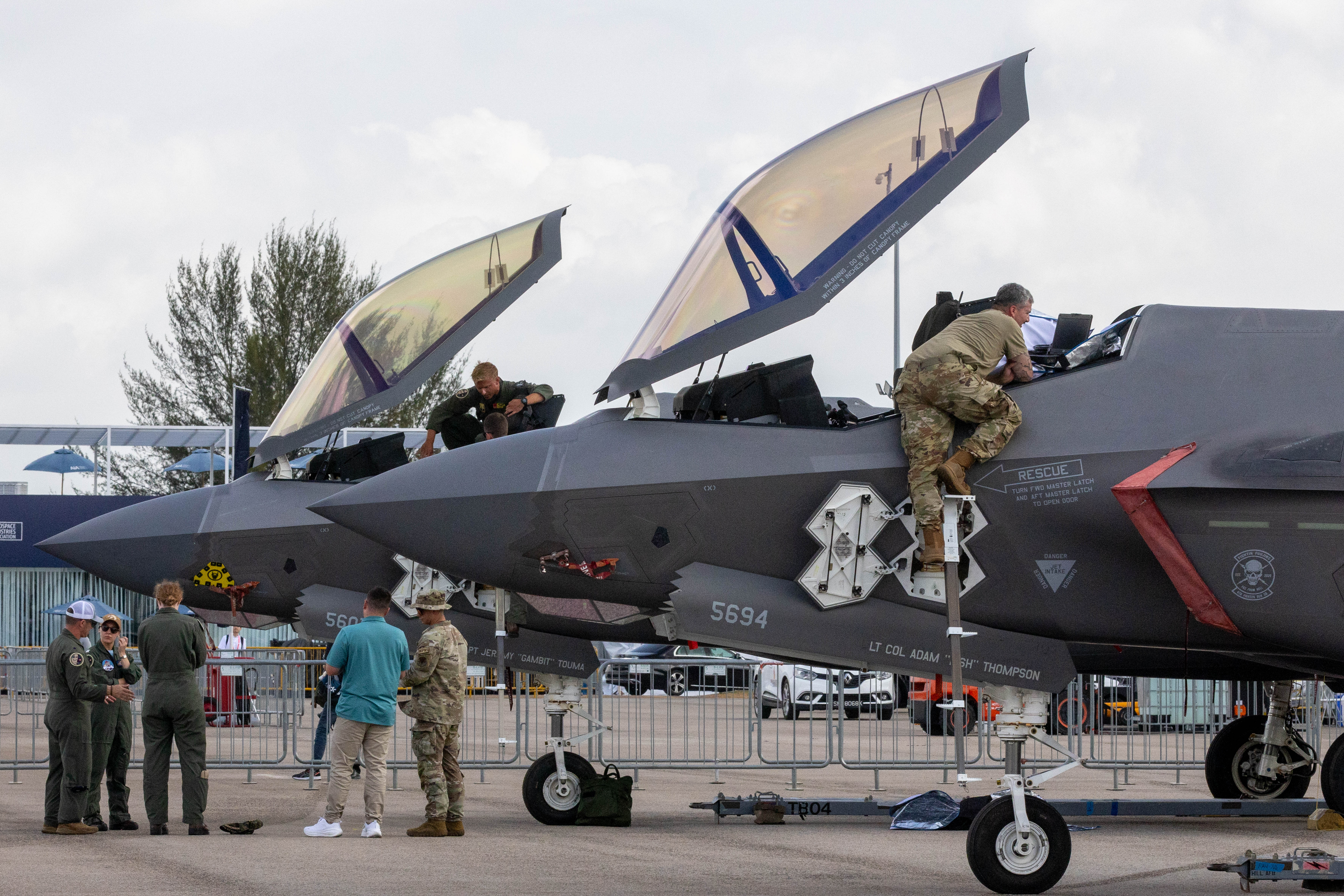 Members of the US Air Force check the fighter jet during the 10th Singapore Airshow in Singapore, on February 5, 2026 in Singapore.