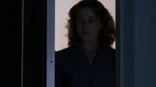 A screen shot of Francis McDormand looking through a doorway in Blood Simple.