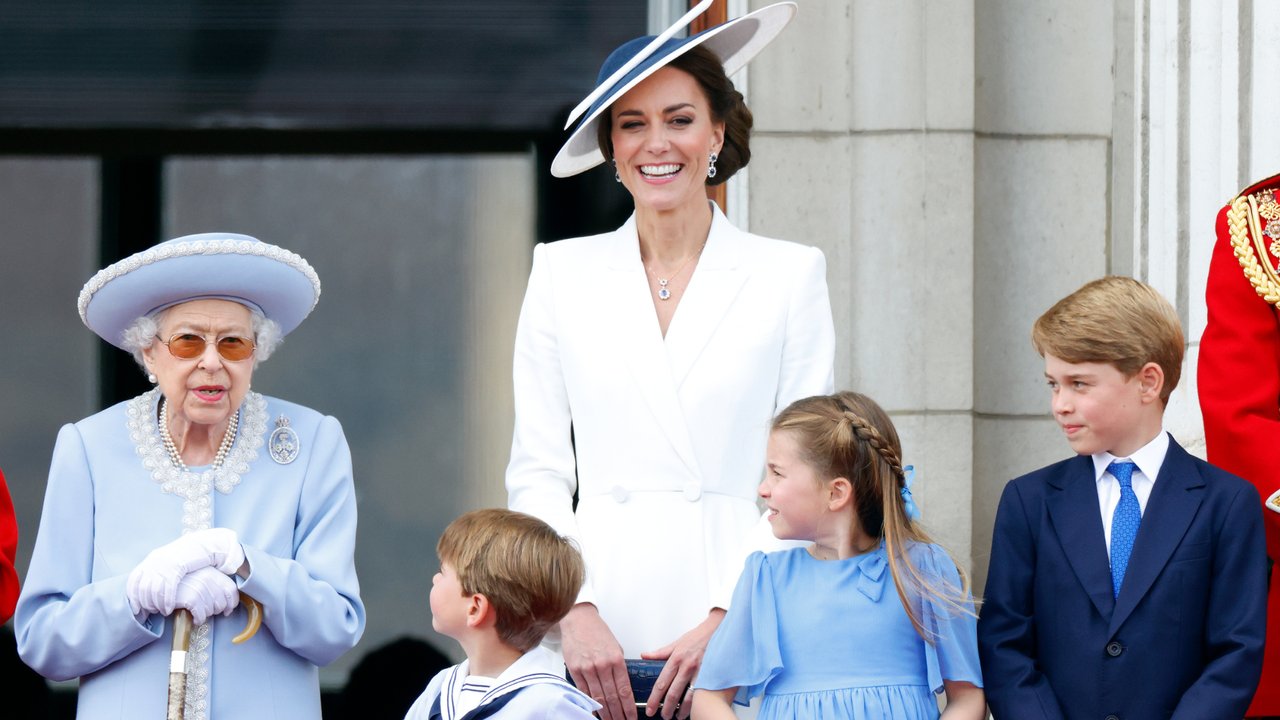 Queen Elizabeth II, Prince Louis of Cambridge, Catherine, Duchess of Cambridge, Princess Charlotte of Cambridge and Prince George of Cambridge watch a flypast from the balcony of Buckingham Palace during Trooping the Colour on June 2, 2022 in London, England. Trooping The Colour, also known as The Queen&#039;s Birthday Parade, is a military ceremony performed by regiments of the British Army that has taken place since the mid-17th century. It marks the official birthday of the British Sovereign. This year, from June 2 to June 5, 2022, there is the added celebration of the Platinum Jubilee of Elizabeth II in the UK and Commonwealth to mark the 70th anniversary of her accession to the throne on 6 February 1952