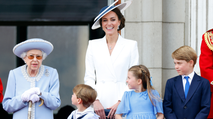 Queen Elizabeth II, Prince Louis of Cambridge, Catherine, Duchess of Cambridge, Princess Charlotte of Cambridge and Prince George of Cambridge watch a flypast from the balcony of Buckingham Palace during Trooping the Colour on June 2, 2022 in London, England. Trooping The Colour, also known as The Queen's Birthday Parade, is a military ceremony performed by regiments of the British Army that has taken place since the mid-17th century. It marks the official birthday of the British Sovereign. This year, from June 2 to June 5, 2022, there is the added celebration of the Platinum Jubilee of Elizabeth II in the UK and Commonwealth to mark the 70th anniversary of her accession to the throne on 6 February 1952