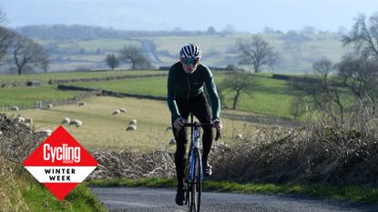 Image shows a rider cycling in winter.