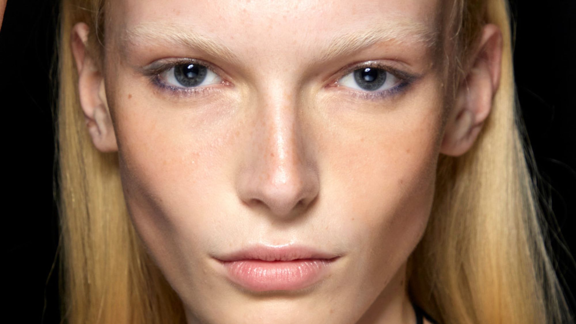 alex consani backstage with bronzed cheeks