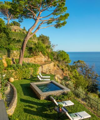 mediterranean hillside terraced garden with plunge pool and loungersb