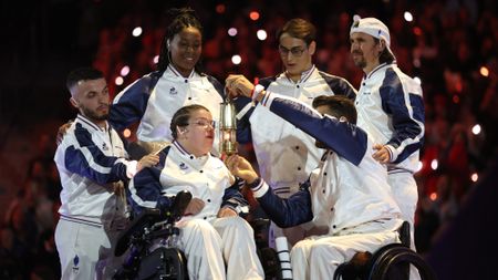 Aurelie Aubert of Team France blows out the Olympic Flame during the closing ceremony of the 2024 Paralympic Games.