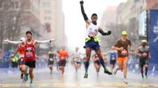 BOSTON, MASSACHUSETTS - APRIL 17: Fernando Ferreira celebrates in the rain as he crosses the finish line during the 127th Boston Marathon on April 17, 2023 in Boston, Massachusetts. (Photo by Maddie Meyer/Getty Images)