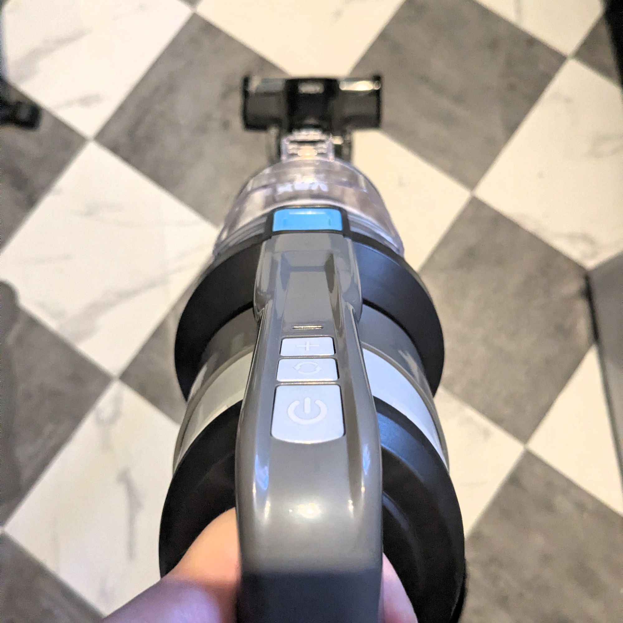 VAX Pace Plus Cordless Vacuum Cleaner being used on black and white flooring