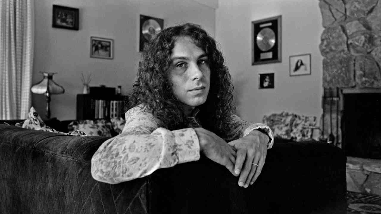 Ronnie James Dio posing for a photograph at home in the late 1970s