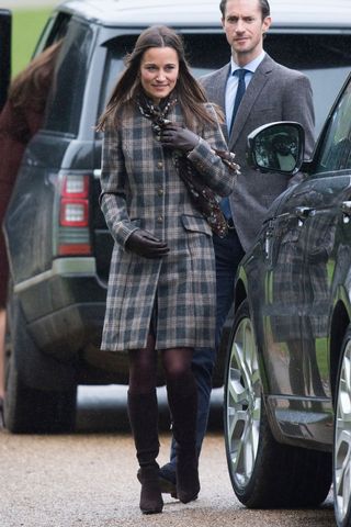 Pippa Middleton in knee high boots and check coat