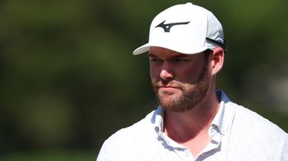 Grayson Murray wearing a white Mizuno cap looking on during the Sony Open