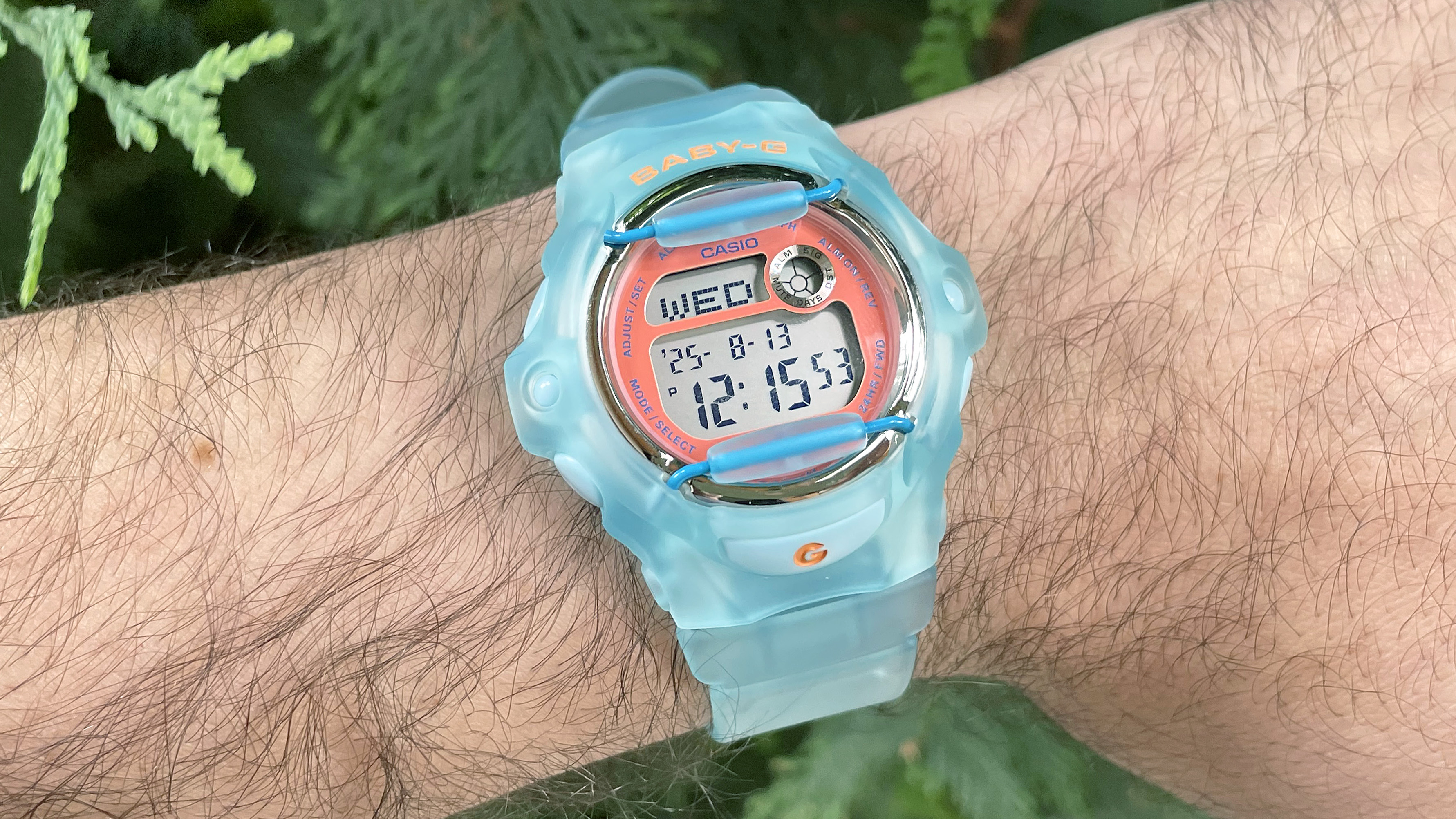 Close-up of the Casio Baby-G BG169 is semitransparent baby blue on the writer's wrist
