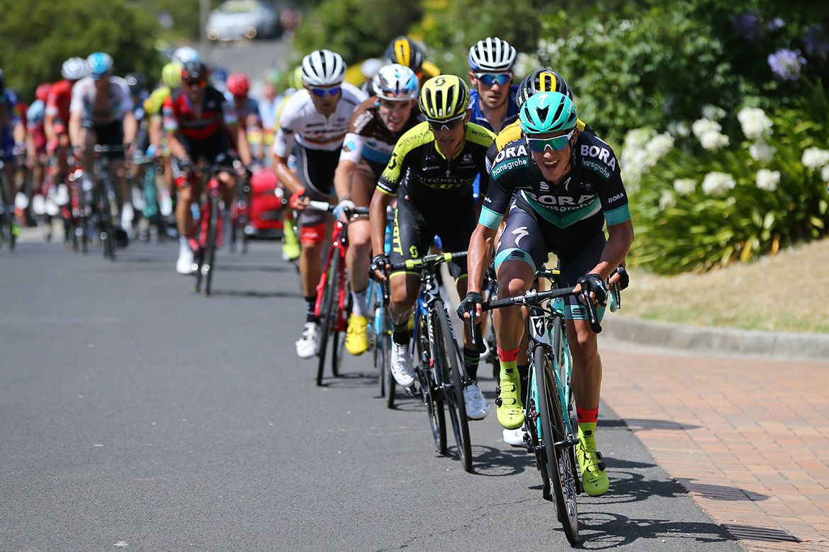 Peter Kennaugh drives the race on