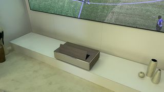 Samsung 8K projector press shot in lounge