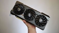 RTX 4070 Ti held by a masculine hand