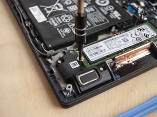 Screw in the single fastener at the end of the SSD.