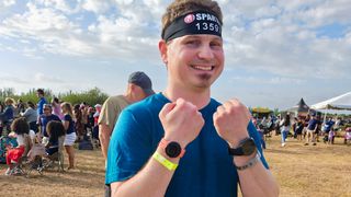 Running at a Spartan Race event while wearing a Google Pixel Watch 3 on one arm and a OnePlus Watch 3 on the other
