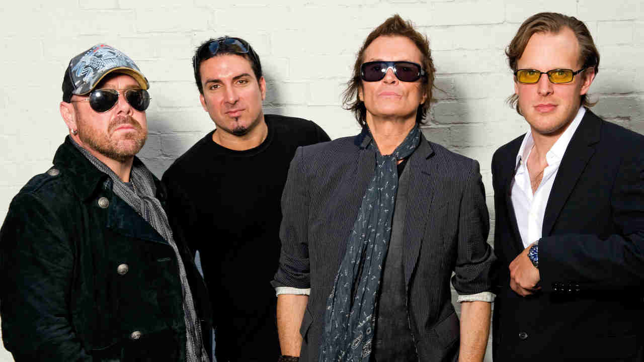 Black Country Communion posing for a photograph in 2011