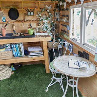 Exterior of grey panelled shed in garden