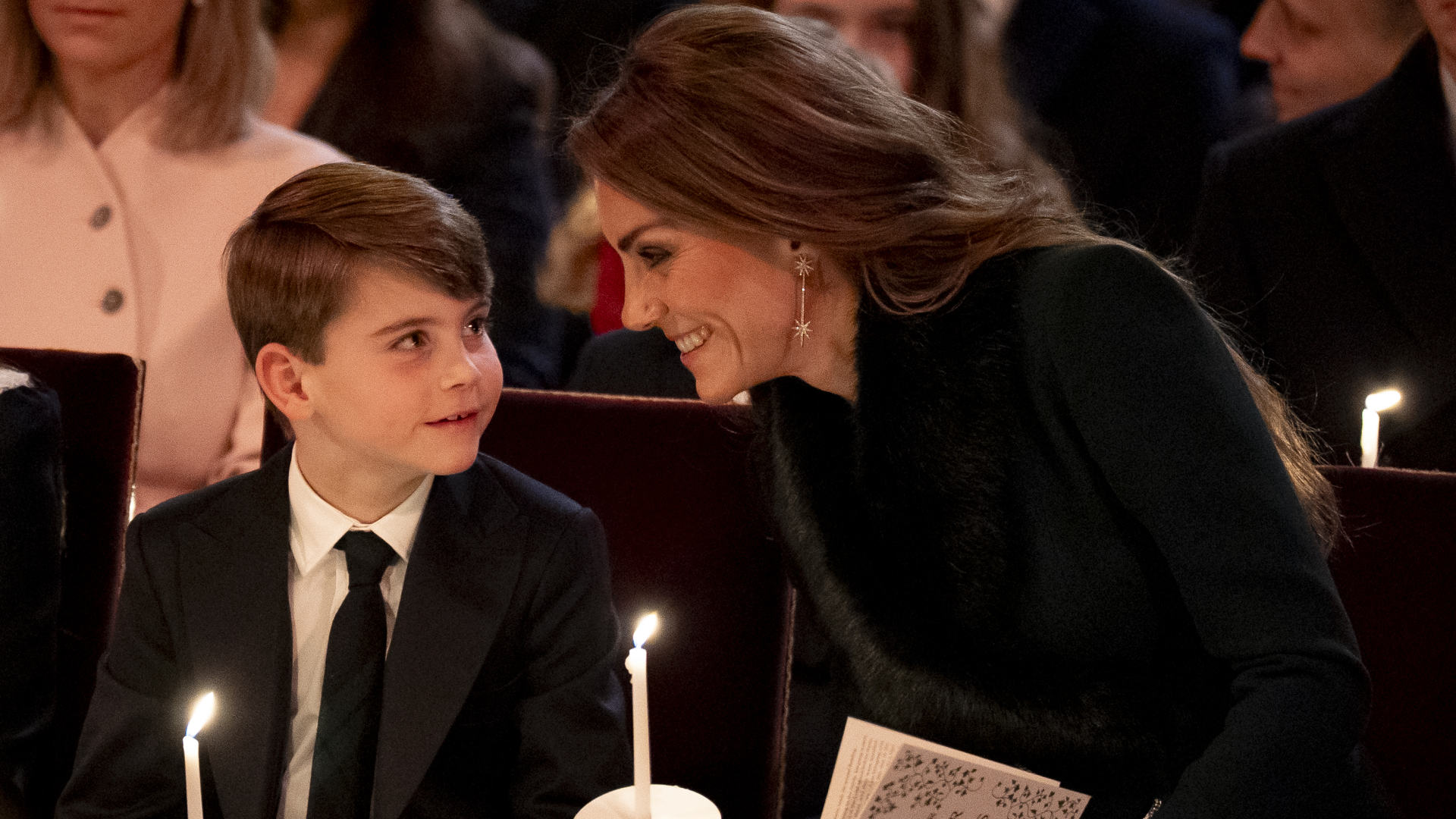Prince Louis and Princess Kate holding candles at the Together at Christmas 2025 concert