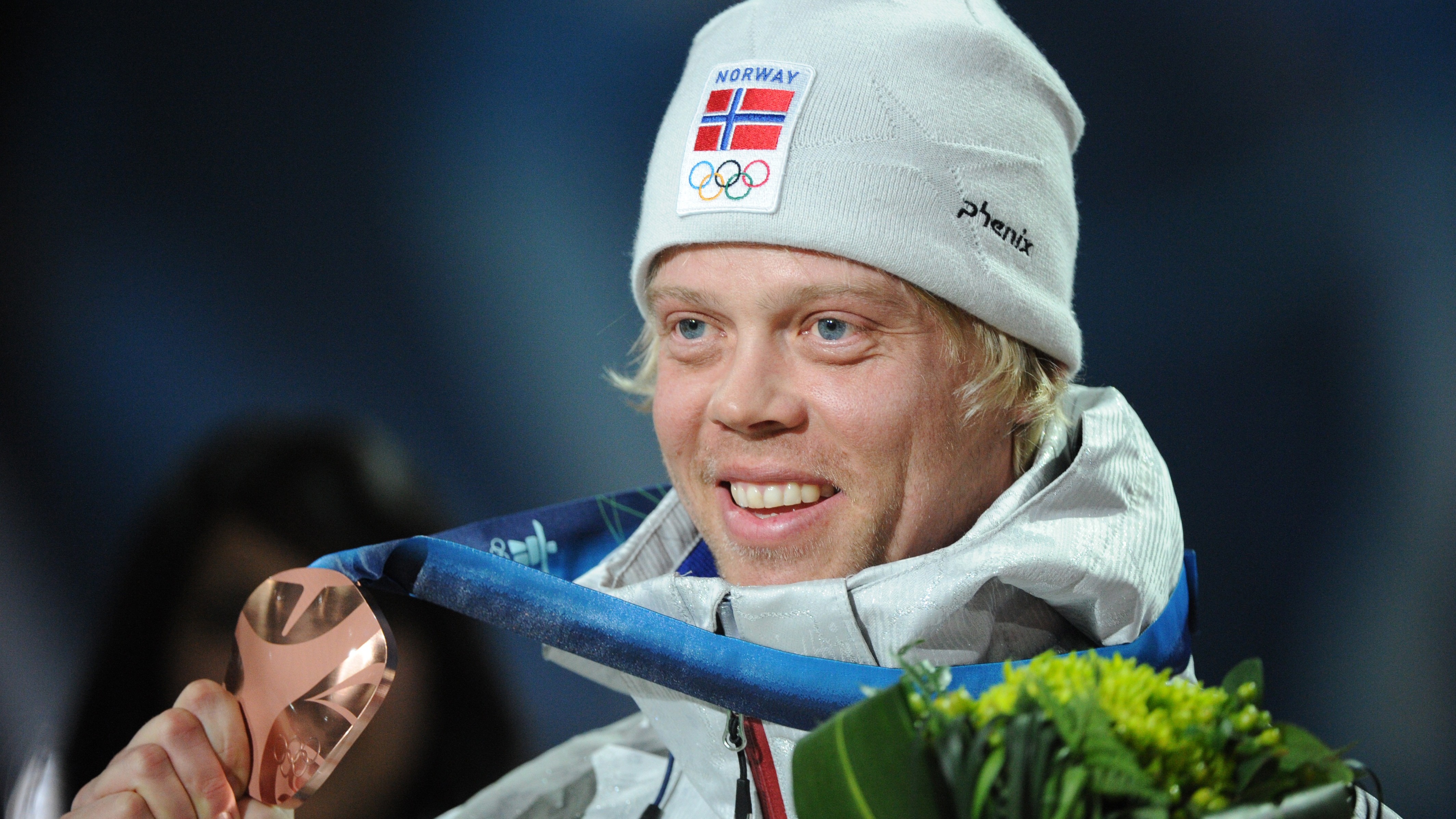 Norway&#039;s bronze winner Audun Groenvold celebrates on the podium during the medal ceremony of the men&#039;s freestyle ski cross final of the Vancouver Winter Olympics, on February 21, 2010