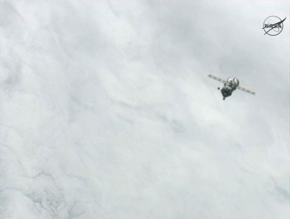 The Russian Soyuz TMA-03M space capsule backs away from the International Space Station after undocking on July 1, 2012.