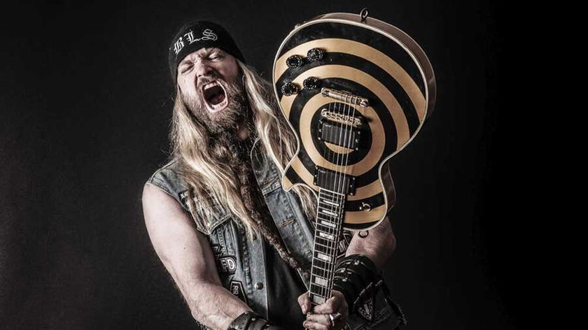Zakk Wylde branding a guitar (studio portrait)