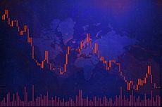 Global stock market downturn, featuring a red candlestick chart against a dark blue world map backdrop