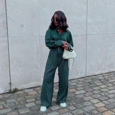 Aida wears her Stan Smiths with a jumpsuit
