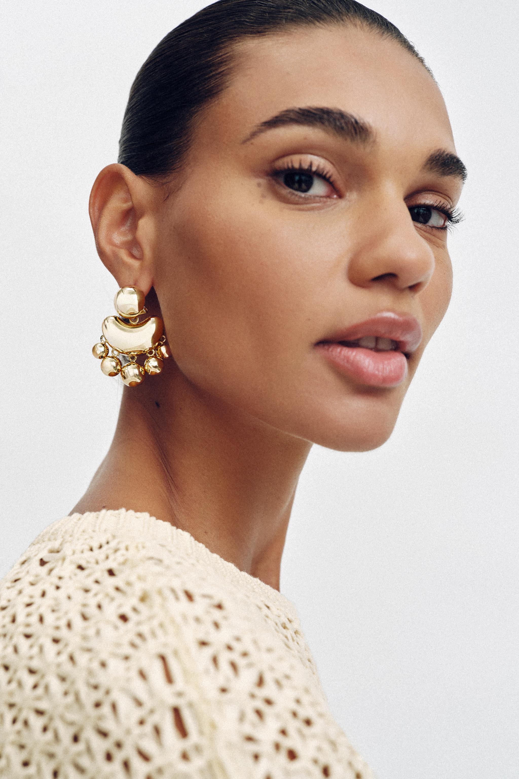 Metal Earrings With Embossed Pieces