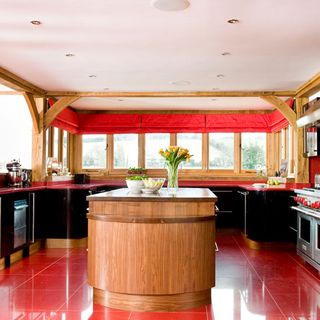 red kitchen area with yellow flower kitchen cabinet