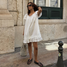 Stylist and fashion person Debora Rosa wears the swing mini dress trend in a recent image take from her Instagram.