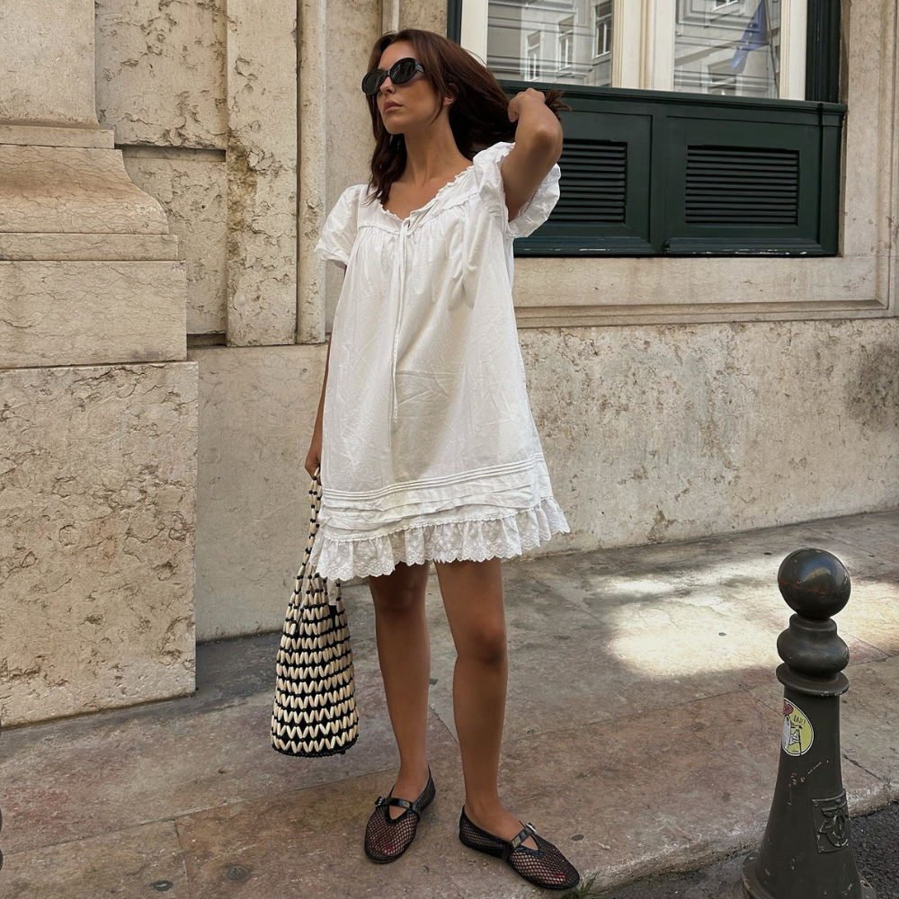 Stylist and fashion person Debora Rosa wears the swing mini dress trend in a recent image take from her Instagram.
